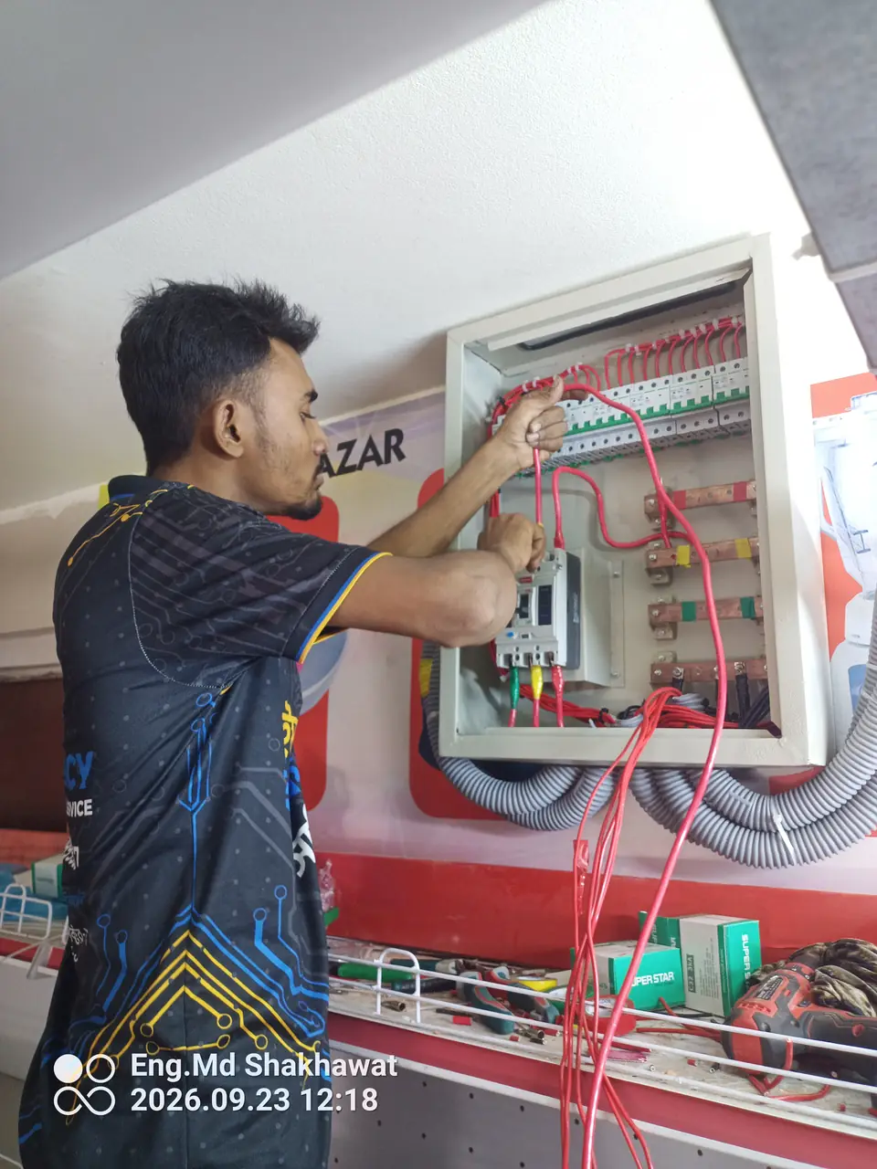 Installing a distribution board at a super shop in Uttara